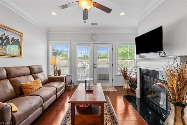 3615 Sainsbury Ln, Greensboro, NC 27409 - living area with a glass covered fireplace, wood finished floors, ceiling fan, ornamental molding, and recessed lighting