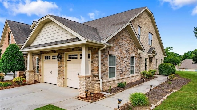 3615 Sainsbury Ln, Greensboro, NC 27409 - craftsman inspired home featuring driveway, a garage, stone siding, and roof with shingles