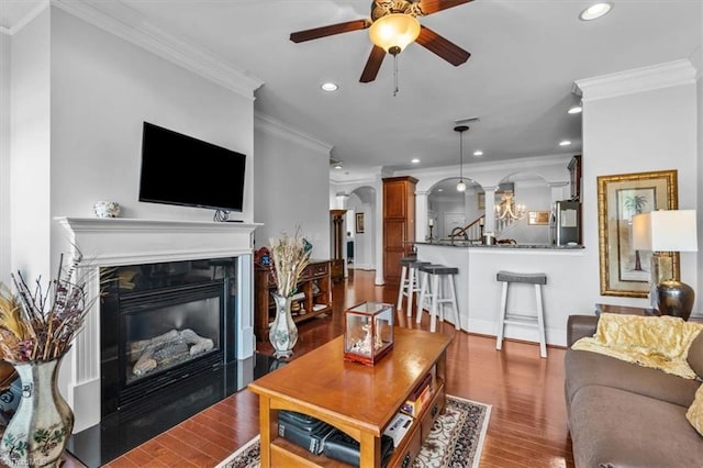 3615 Sainsbury Ln, Greensboro, NC 27409 - living area with recessed lighting, a ceiling fan, wood finished floors, ornate columns, and a glass covered fireplace