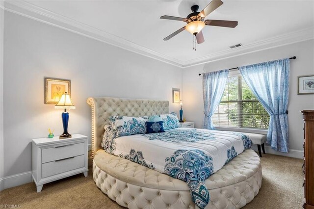 3615 Sainsbury Ln, Greensboro, NC 27409 - carpeted bedroom with ornamental molding, baseboards, and a ceiling fan
