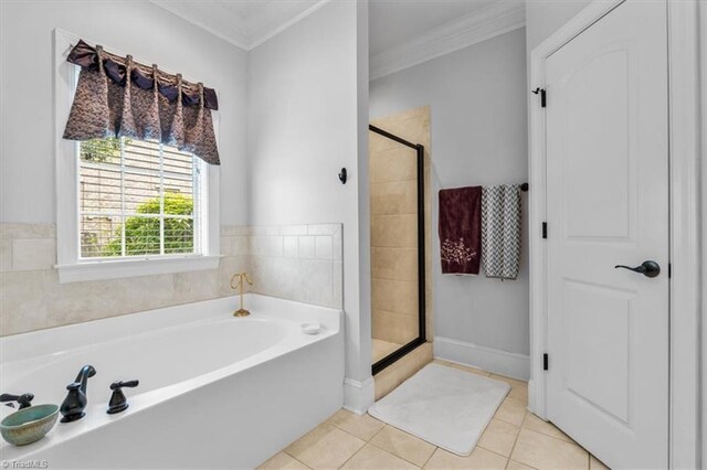 3615 Sainsbury Ln, Greensboro, NC 27409 - bathroom with a stall shower, crown molding, a bath, and tile patterned floors