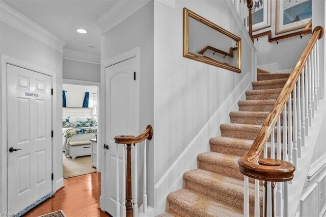 3615 Sainsbury Ln, Greensboro, NC 27409 - stairway featuring ornamental molding, wood finished floors, and recessed lighting