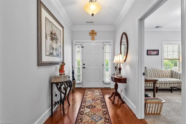 3615 Sainsbury Ln, Greensboro, NC 27409 - foyer with wood finished floors, ornamental molding, and baseboards