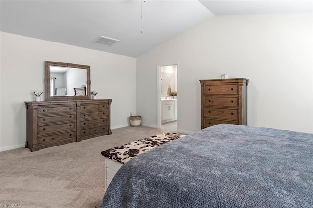 bedroom featuring visible vents, carpet floors, baseboards, lofted ceiling, and ensuite bathroom