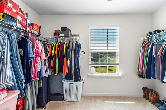 walk in closet featuring carpet floors and visible vents