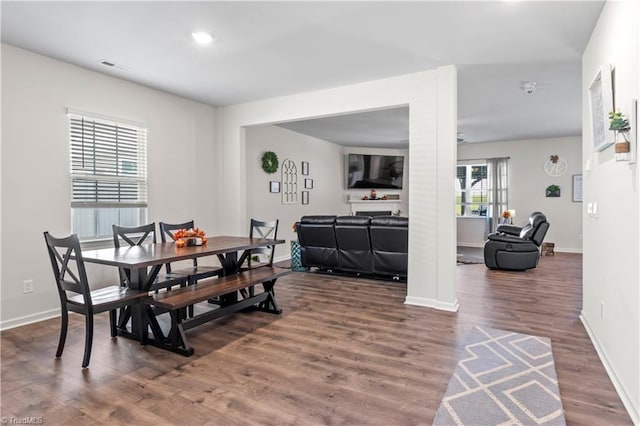 dining area with recessed lighting, baseboards, visible vents, and wood finished floors