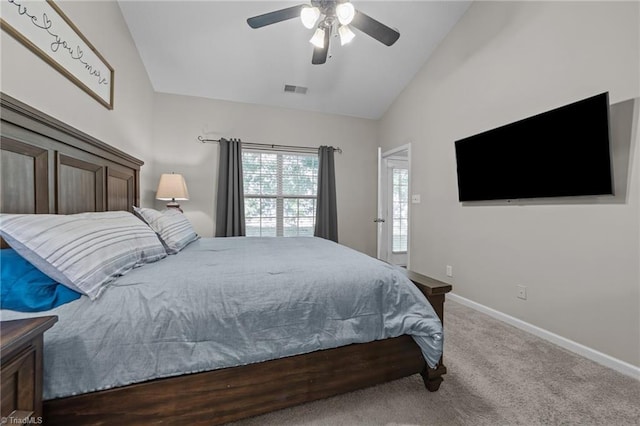 carpeted bedroom with lofted ceiling, baseboards, and a ceiling fan