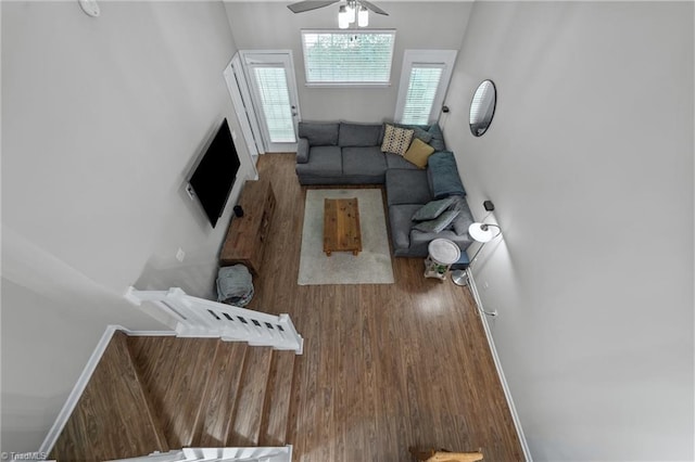 living room featuring wood finished floors and ceiling fan