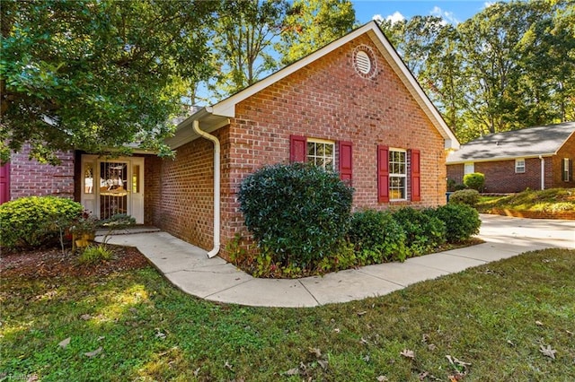 view of home's exterior with a yard