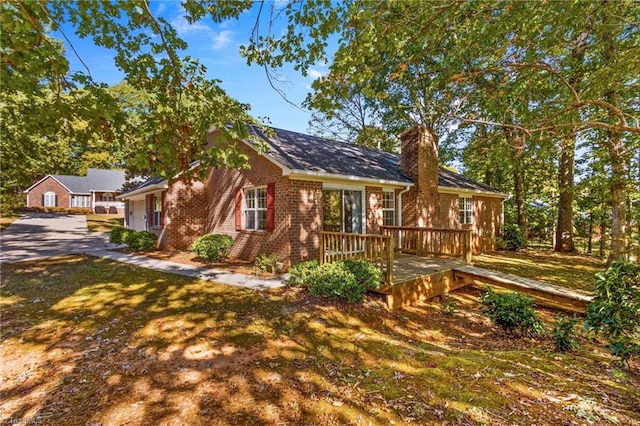 view of front of home featuring a wooden deck