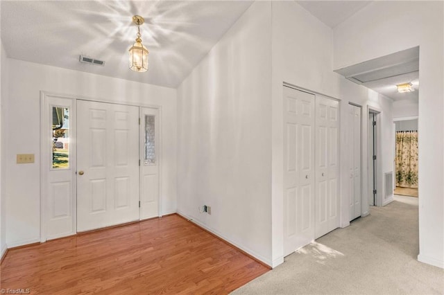 entrance foyer featuring light hardwood / wood-style floors