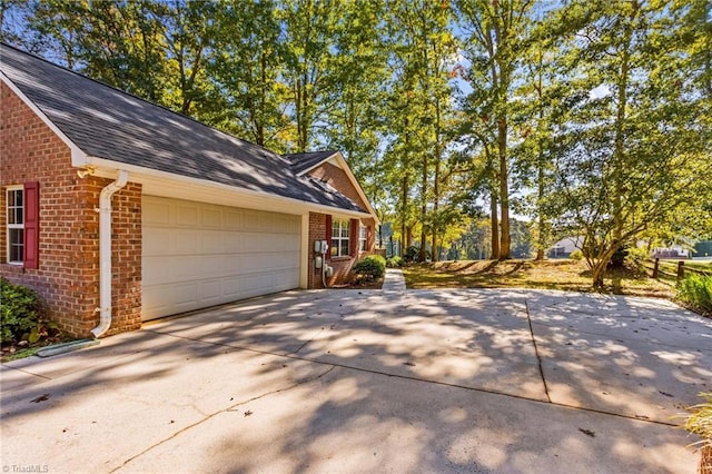 view of side of home with a garage