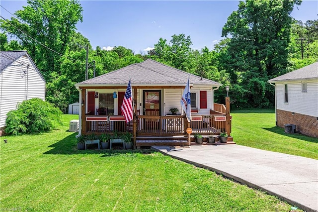 1602 Larkin St, High Point, NC 27262 - bungalow-style house with a front yard, a storage shed, covered porch, an outbuilding, and central AC unit