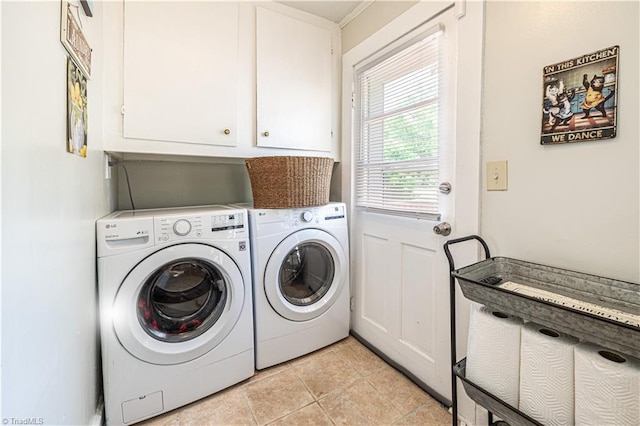 1602 Larkin St, High Point, NC 27262 - laundry room with washing machine and dryer, cabinet space, and light tile patterned flooring