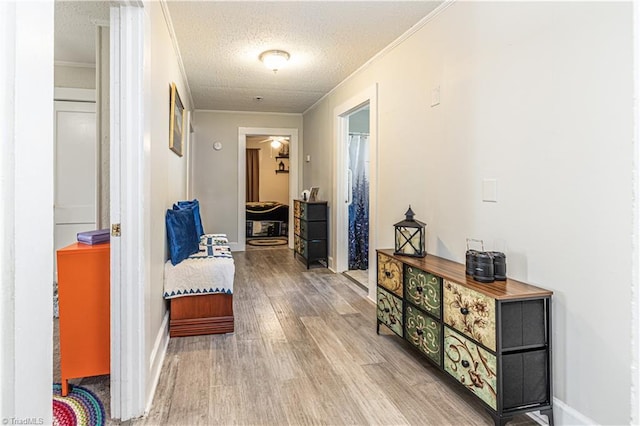 1602 Larkin St, High Point, NC 27262 - corridor featuring wood finished floors, crown molding, a textured ceiling, and baseboards