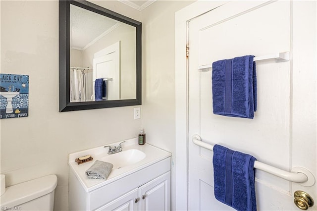 1602 Larkin St, High Point, NC 27262 - bathroom featuring ornamental molding, toilet, and vanity
