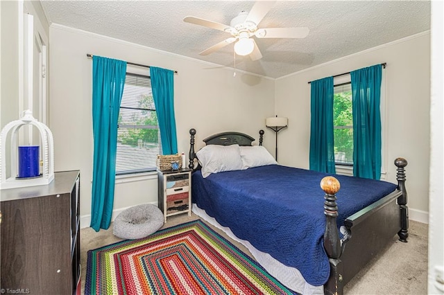 1602 Larkin St, High Point, NC 27262 - carpeted bedroom featuring a textured ceiling, multiple windows, crown molding, a ceiling fan, and baseboards