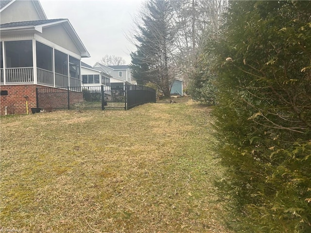 view of yard with a sunroom and fence