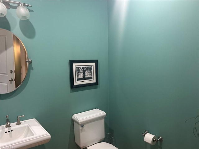 bathroom with a sink and toilet