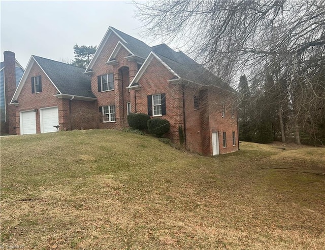 view of front of house with a front lawn and brick siding