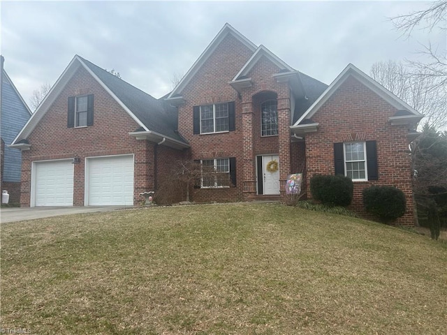 traditional home with driveway, a front yard, and brick siding