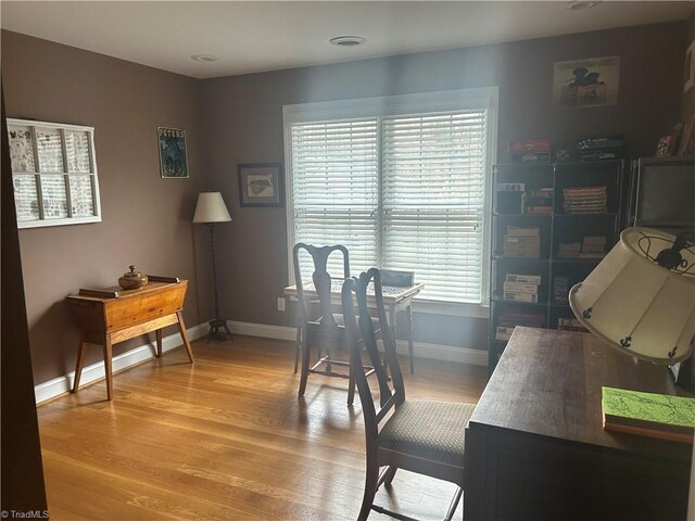 office featuring light wood-style floors and baseboards