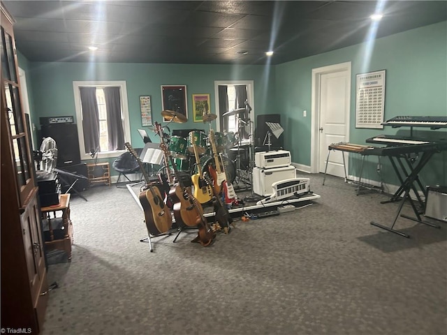 workout area featuring carpet floors and baseboards