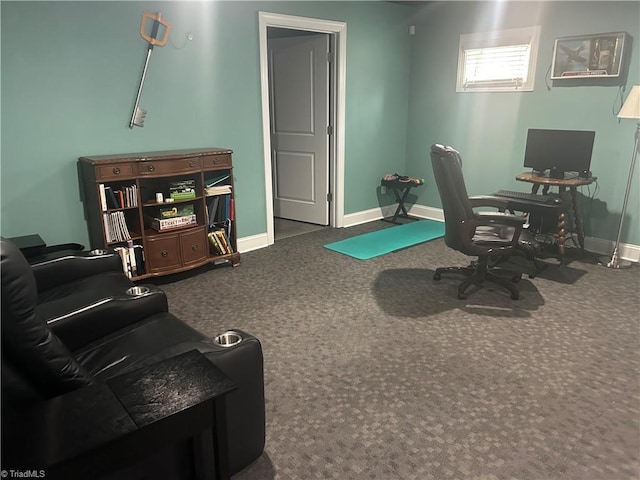 carpeted home office featuring baseboards