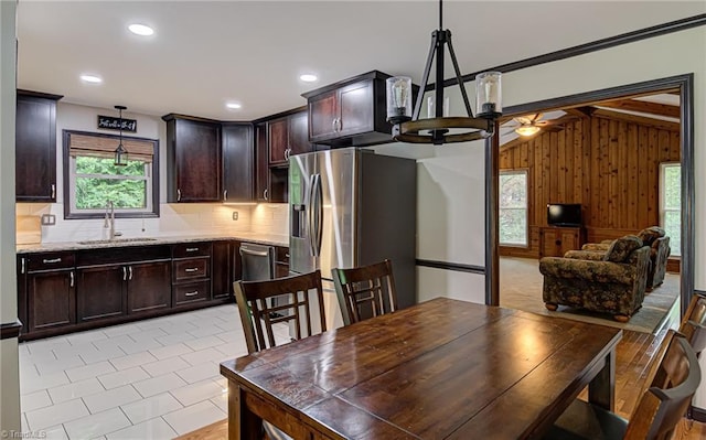 interior space featuring light tile patterned floors, wooden walls, recessed lighting, and lofted ceiling