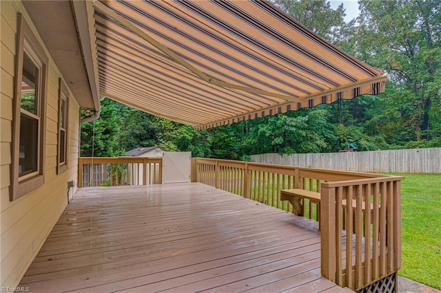 deck featuring a yard and fence