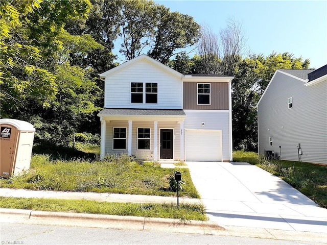 805 Granby Ave, High Point, NC 27260 - traditional-style house with concrete driveway, a garage, a porch, and board and batten siding