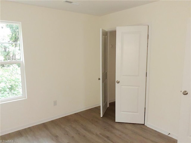 805 Granby Ave, High Point, NC 27260 - unfurnished room with wood finished floors and baseboards