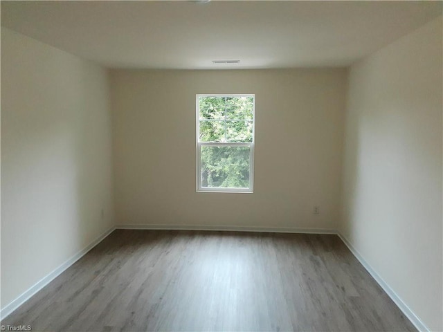 805 Granby Ave, High Point, NC 27260 - unfurnished room with wood finished floors and baseboards