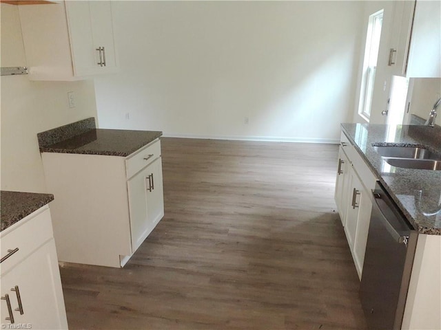 805 Granby Ave, High Point, NC 27260 - kitchen with dishwasher, wood finished floors, dark stone counters, and white cabinetry