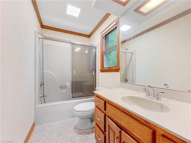 full bathroom featuring enclosed tub / shower combo, vanity, crown molding, tile patterned floors, and toilet