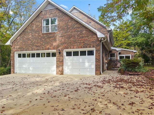 view of side of property with a garage