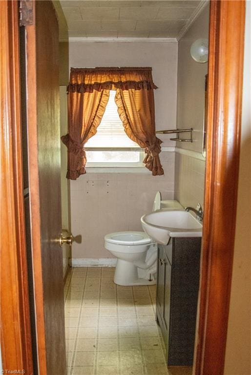 2446 Greenway St, Burlington, NC 27217 - bathroom with vanity, tile patterned floors, and ornamental molding