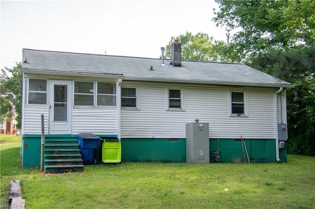 2446 Greenway St, Burlington, NC 27217 - rear view of house with a lawn, crawl space, and a chimney