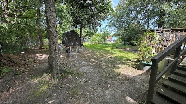 112 White St, Thomasville, NC 27360 - fenced backyard featuring a storage unit and stairs