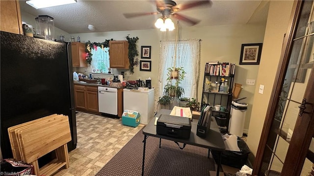 112 White St, Thomasville, NC 27360 - kitchen with white dishwasher, freestanding refrigerator, a ceiling fan, and dark countertops