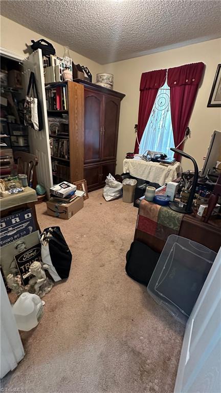 112 White St, Thomasville, NC 27360 - bedroom with a textured ceiling and carpet flooring