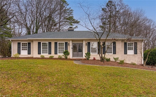 single story home featuring a front lawn