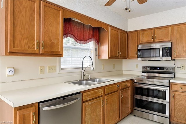 kitchen featuring sink, ceiling fan, and appliances with stainless steel finishes