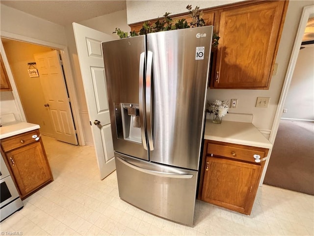 kitchen with stainless steel refrigerator with ice dispenser