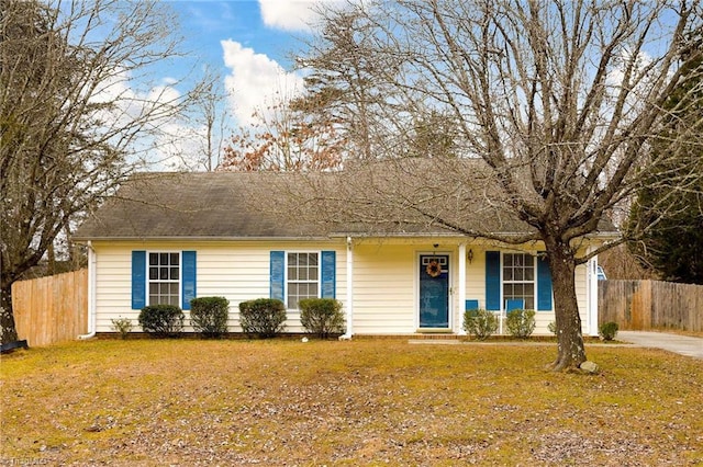 single story home featuring a front yard