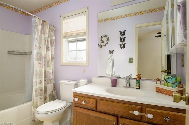 full bathroom with toilet, vanity, and shower / tub combo with curtain