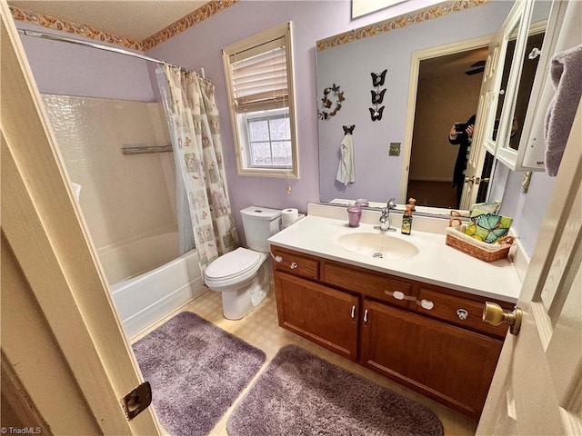 full bathroom featuring vanity, toilet, and shower / bath combination with curtain