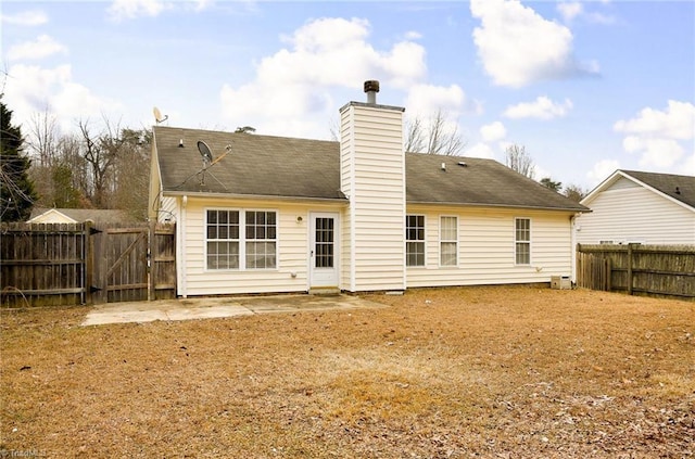 rear view of property featuring a patio area