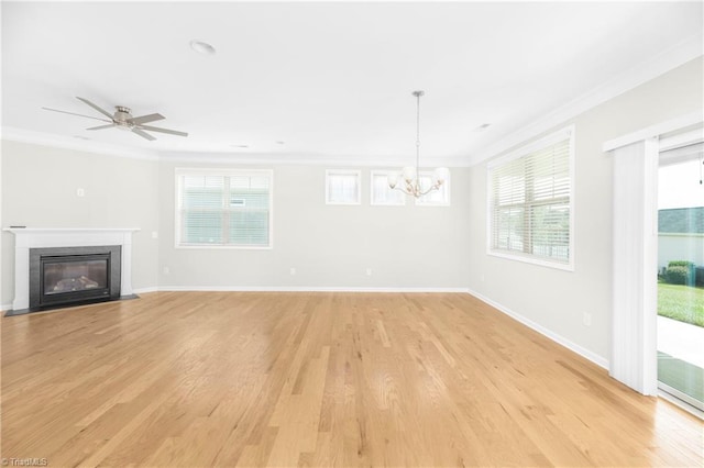 unfurnished living room with light hardwood / wood-style floors, ornamental molding, and ceiling fan with notable chandelier