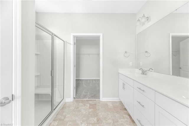 bathroom featuring vanity, tile patterned flooring, and an enclosed shower